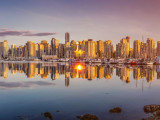 Beautiful Vancouver skyline and harbor area in golden evening light, Canada